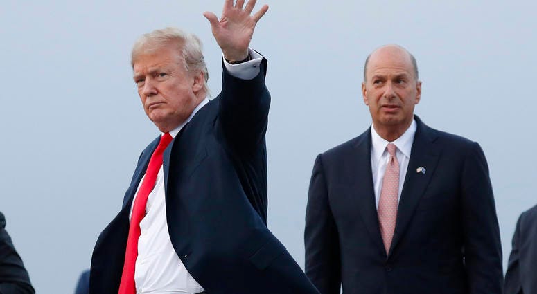 In this July 10, 2018, file photo, President Donald Trump is joined by Gordon Sondland, the U.S. ambassador to the European Union, second from right, as he arrives at Melsbroek Air Base, in Brussels, Belgium. Gordon Sondland