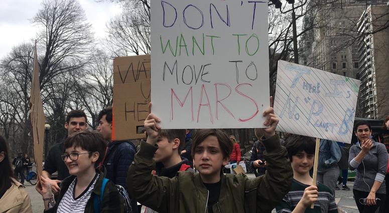 Students march through Manhattan to demand action on climate change on March 15, 2019. Students Climate Change protest