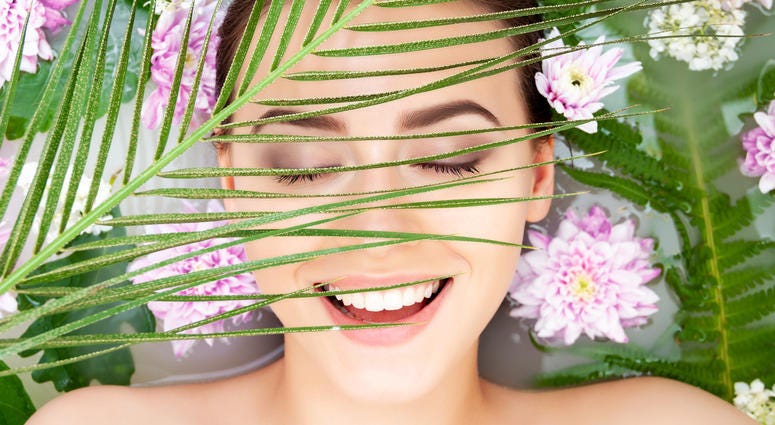 Woman surrounded by flowers