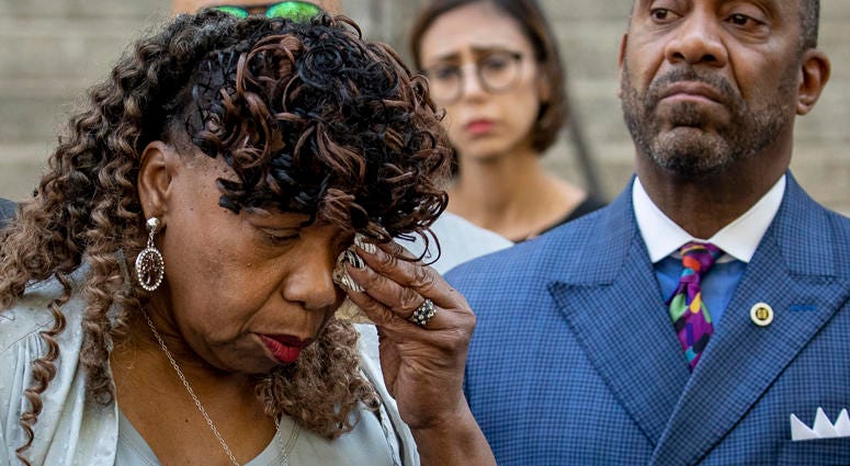 Gwen Carr, mother of the late Eric Garner, wipes away tears after speaking to the press outside the U.S. Attorney's office following a meeting with federal prosecutors, July 16, 2019 in Brooklyn. Gwen Carr, Eric Garner's mother