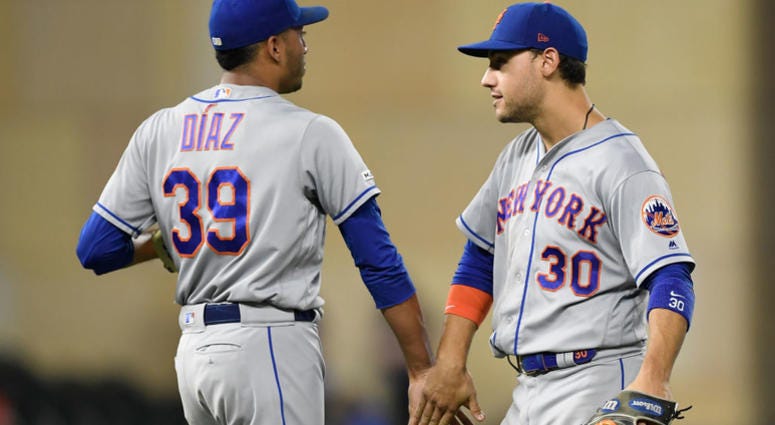 Edwin Diaz #39 and Michael Conforto #30 of the New York Mets celebrate defeating the Minnesota Twins after the interleague game on July 16, 2019 at Target Field in Minneapolis, Minnesota. Edwin Diaz #39 and Michael Conforto #30 of the New York Mets celebrate defeating the Minnesota Twins after the interleague game on July 16, 2019 at Target Field in Minneapolis, Minnesota.