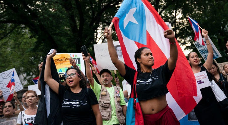 Protestors rally against Ricardo Rossello, the Governor of Puerto Rico, in Columbus Circle on July 22, 2019 in New York City. PR Protests Columbus Circle