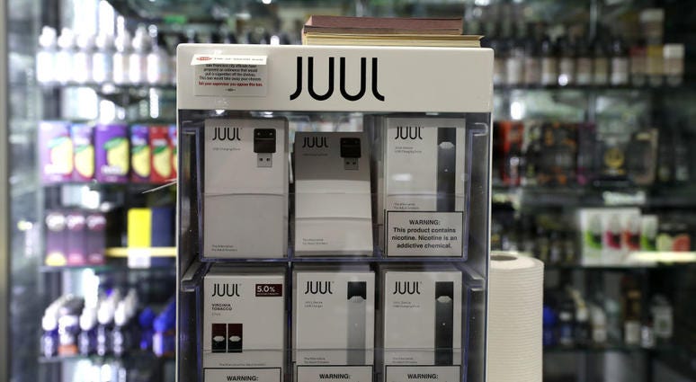 E-Cigarettes made by Juul are displayed at Smoke and Gift Shop on June 25, 2019 in San Francisco, California. Juul