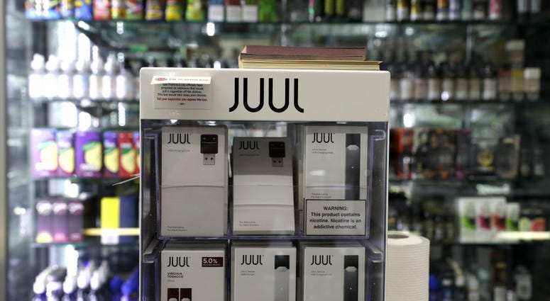 E-Cigarettes made by Juul are displayed at Smoke and Gift Shop on June 25, 2019 in San Francisco, California. E-Cigarettes