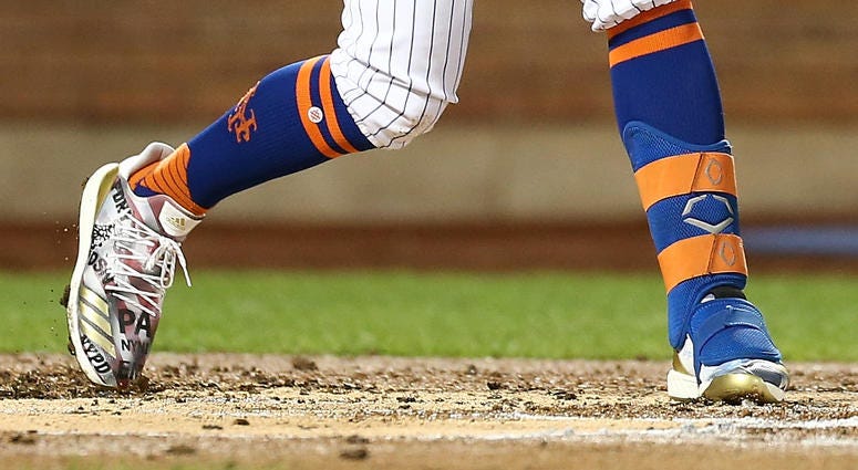 J.D. Davis #28 of the New York Mets hits an RBI single to left field in the first inning against the Arizona Diamondbacks at Citi Field on September 11, 2019 in the Queens borough of New York City. J.D. Davis 9/11 cleats