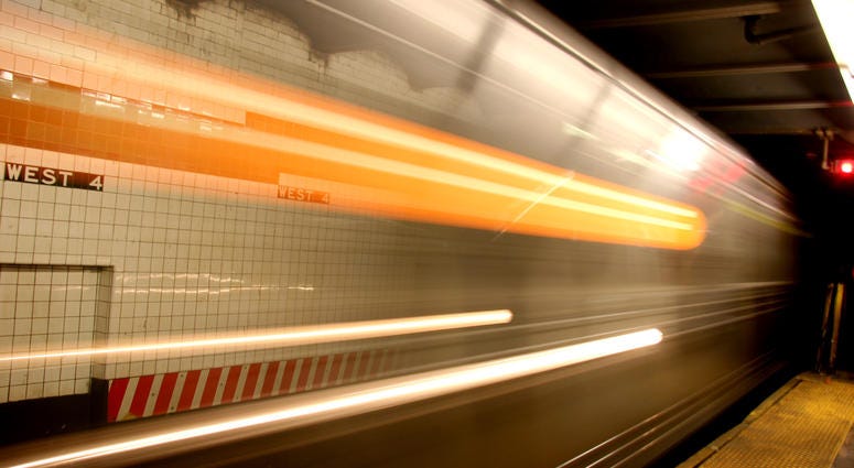 New York subway approaching a station with motion blur and moving lights. Blurred Subway Train