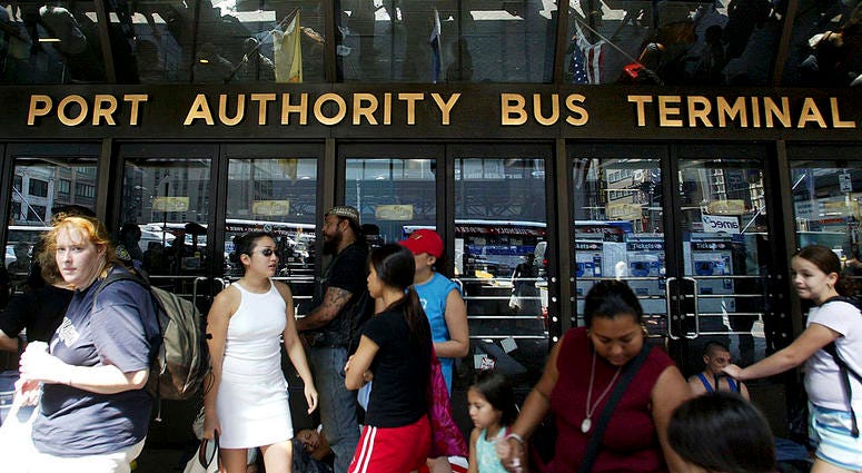 Stranded travellers gather outside the closed Port Authority Bus Terminal during a massive blackout August 15, 2003 in New York City. Port Authority Bus Terminal