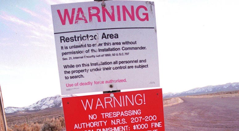 A warning sign marks the boundary of Area 51, March 12, 2000 in Rachel, Nevada Area 51
