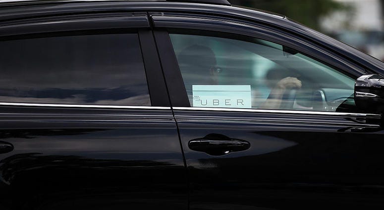 An Uber vehicle is viewed in Manhattan on July 20, 2015 in New York City. Uber