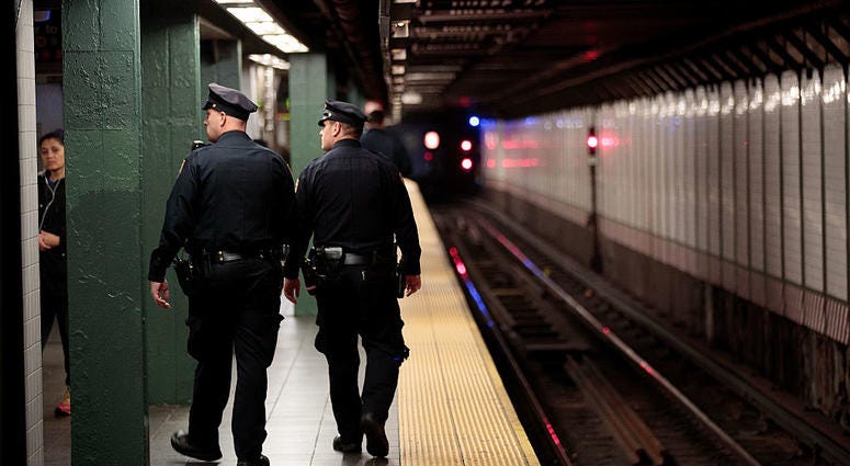 Members of the New York City Police patrol a subway station in Times Square, November 7, 2016 in New York City. MTA Police