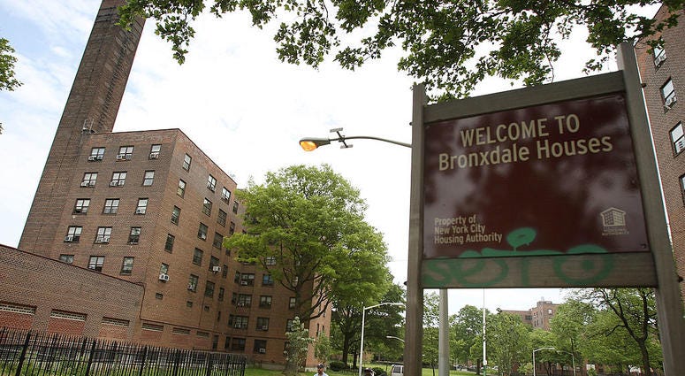 People walk in front of the Bronxdale Houses public housing projects where President Obama`s pick for the Supreme Court, Judge Sonia Sotomayor, grew up May 26, 2009 in the Bronx borough of New York City. NYCHA