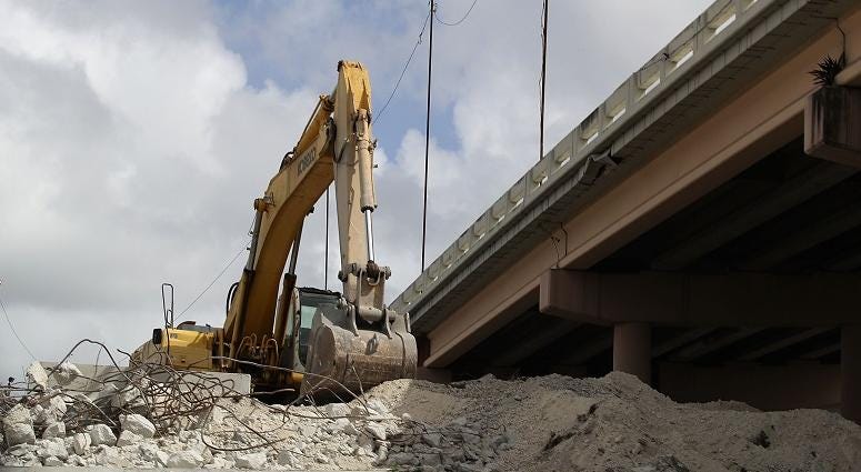 Heavy machinery is seen as construction workers build along State Road 836 on February 12, 2018 in Miami, Florida. Florida bridge construction
