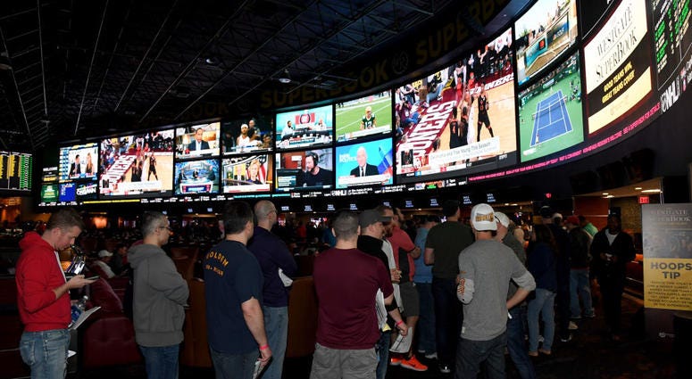 Guests line up to place bets as they attend a viewing party for the NCAA Men's College Basketball Tournament inside the 25,000-square-foot Race & Sports SuperBook at the Westgate Las Vegas Resort & Casino on March 15, 2018 in Las Vegas, Nevada. Sports Betting (Getty)