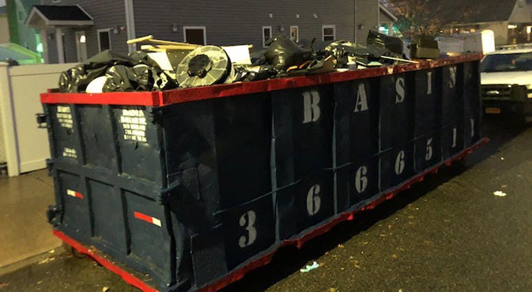 Destroyed items destined for the dump after a sewage backup in Queens Sewage backup in Queens