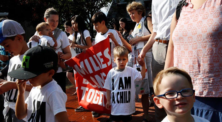 Children and their families gather to march in a protest demanding the reunification of separated immigrant families, Thursday, July 26, 2018, on Capitol Hill in Washington. Separated Children Protest