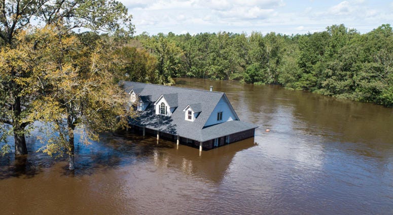 Homes on the Wood family's property are seen severely flooded Tuesday, Sept. 18, 2018, in the aftermath of Florence in Linden, N.C. Hurricane Florence Flooding
