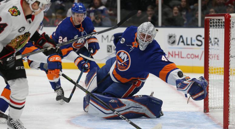 Chicago Blackhawks center Dominik Kahun (24) scores a goal against New York Islanders goalie Robin Lehner (40) during the first period at Nassau Veterans Memorial Coliseum. New York Islanders