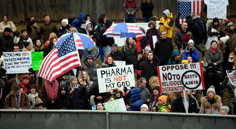 Anti-vaccination protesters stand outside of the New Jersey State House as the Assembly passes a bill to limit vaccine religious exemptions on Monday, Dec. 16, 2019, in Trenton. Vaccines New Jersey