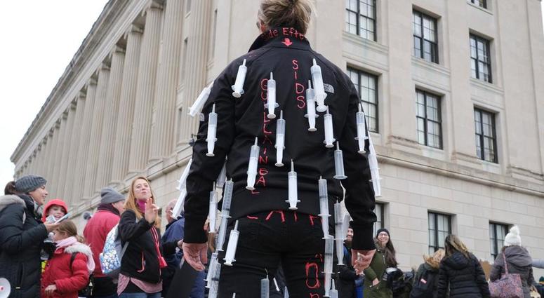 Melissa Koscielniak wears syringes all over her body during a protest at the state house in Trenton, N.J., Monday, Jan. 13, 2020. Vaccine Protest (AP)