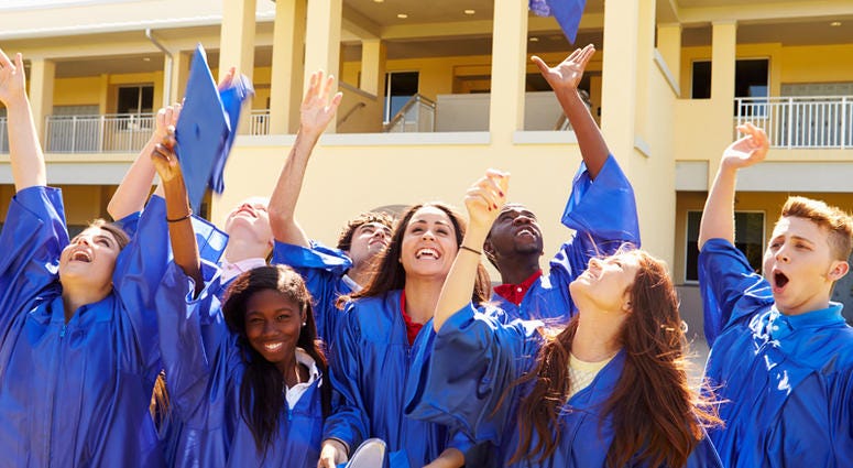 Group of high school students celebrating graduation High School Graduation
