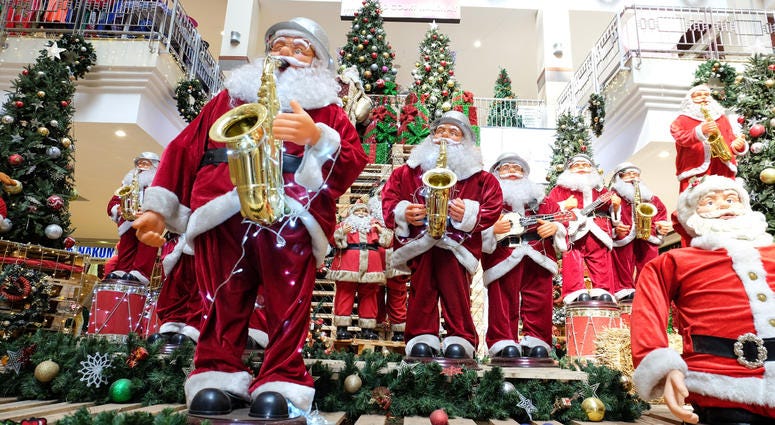 Santa Claus toys are seen at a shopping mall in Nairobi, Kenya, on Dec. 24, 2016. Christmas decorations