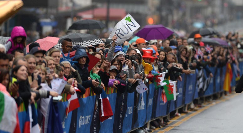 A man holds a sign along Central Park South, 59th Street, during the 2017 TCS New York City Marathon in New York, NY, on November 5, 2017. 2017 TCS New York City Marathon