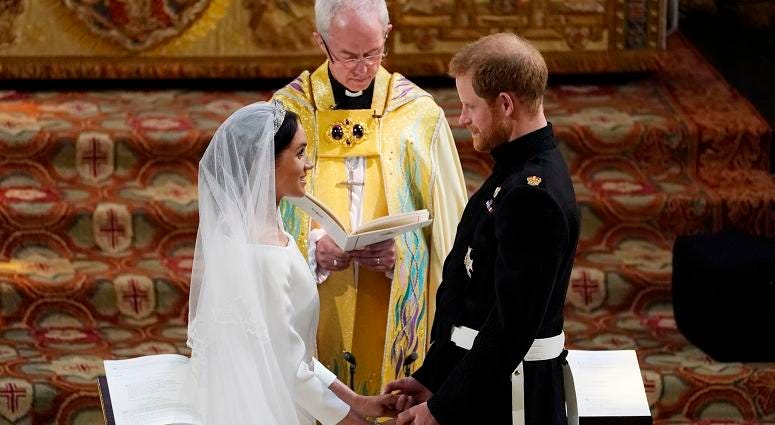 Prince Harry and Meghan Markle exchange vows in St George's Chapel at Windsor Castle during their wedding service, conducted by the Archbishop of Canterbury Justin Welby. The Royal Wedding