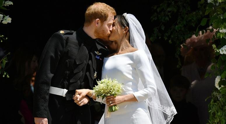 Prince Harry and Meghan Markle kiss as they leave St George's Chapel in Windsor Castle after their wedding. The Royal Wedding