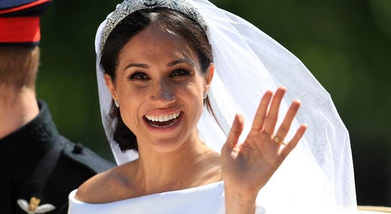 Prince Harry and Meghan Markle ride in an Ascot Landau along the Long Walk after their wedding in St George's Chapel in Windsor Castle The Royal Wedding