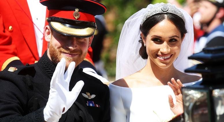 Prince Harry and Meghan Markle ride in an open-topped carriage through Windsor after their wedding in St George's Chapel. The Royal Wedding
