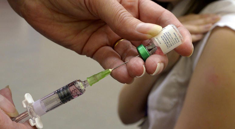 A measles vaccination being administered to a young girl on April 25, 2013. Measles Vaccine