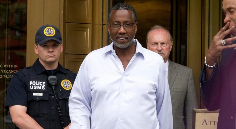 In this June 8, 2016, file photo, Norman Seabrook, center, president of the New York City Correction Officers' Benevolent Association, leaves court, in New York. Norman Seabrook