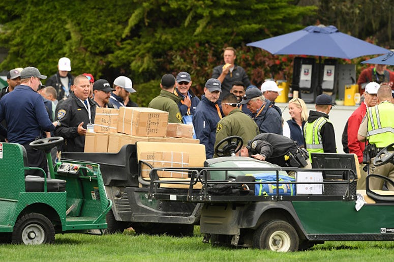 A golf cart loaded with boxes, which was involved an incident, is inspected on the 16th hole during the second round of the 2019 U.S. Open at Pebble Beach Golf Links on June 14, 2019 in Pebble Beach, California. (Photo by Ross Kinnaird/Getty Images) U.S. Open Golf Cart