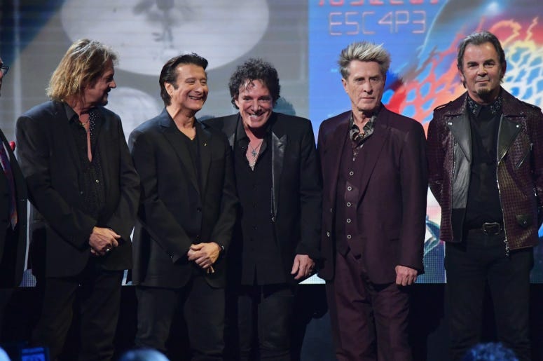 Gregg Rolie, Steve Perry, Neal Schon, Ross Valory and Jonathan Cain of Journey speak onstage at the 32nd Annual Rock & Roll Hall Of Fame Induction Ceremony Gregg Rolie, Steve Perry, Neal Schon, Ross Valory and Jonathan Cain of Journey speak onstage at the 32nd Annual Rock & Roll Hall Of Fame Induction Ceremony