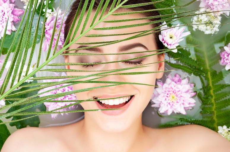 Woman surrounded by flowers