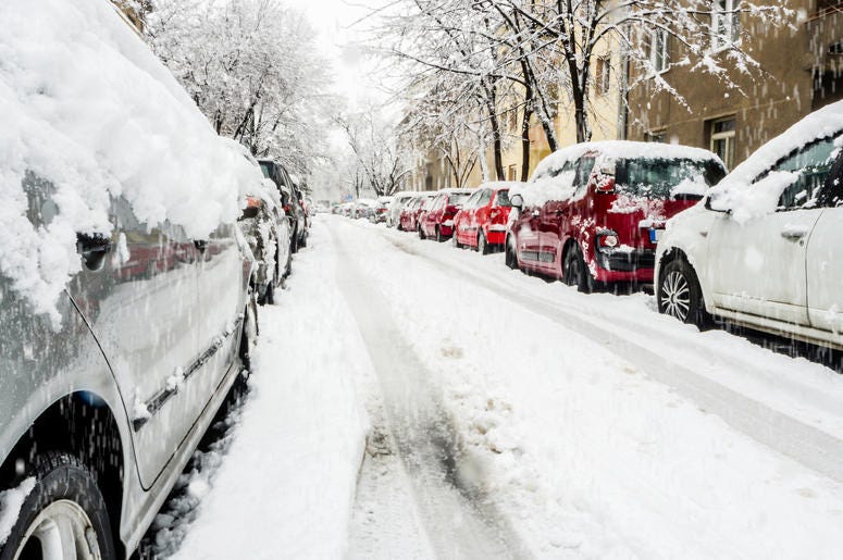 Cars on a snowy city street