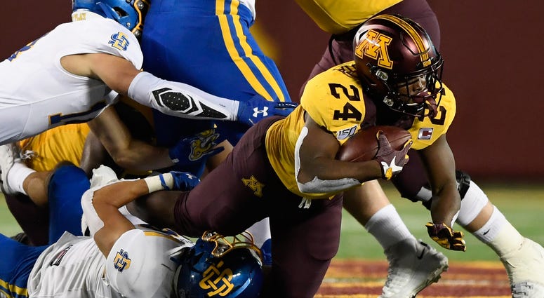 Mohamed Ibrahim carries for the Gophers Gopher running back Mohamed Ibrahim