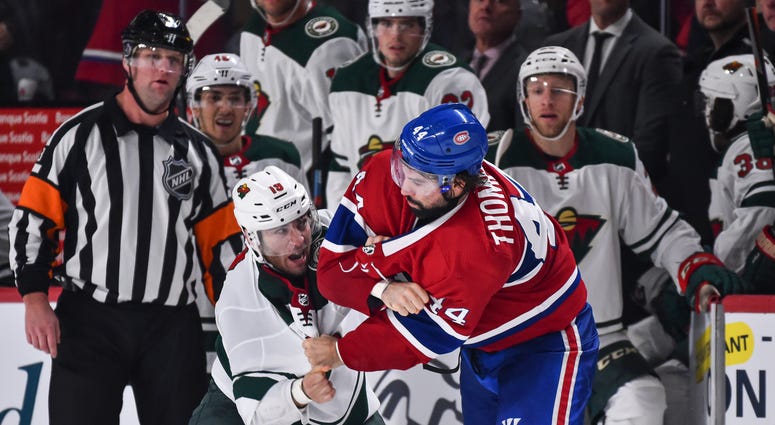 Luke Kunin of the Wild in a fight with Nate Thompson of fhe Wild Luke Kunin upholds the honor of the Wild