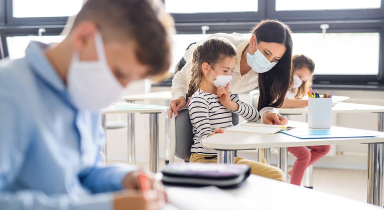 Getty Images Kids in school with masks