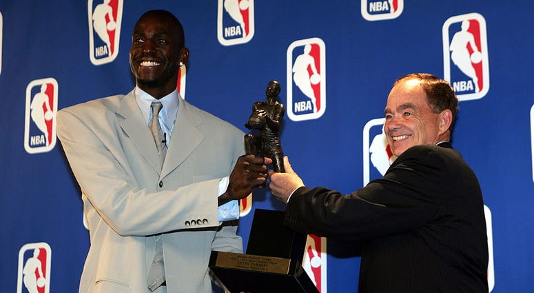 Kevin Garnett #21 of the Minnesota Timberwolves receives the NBA MVP award from Glen Taylor,owner of the Timberwolves on May 3, 2004 at the Target Center in Minneapolis, Minnesota. Kevin Garnett #21 of the Minnesota Timberwolves receives the NBA MVP award from Glen Taylor,owner of the Timberwolves on May 3, 2004 at the Target Center in Minneapolis, Minnesota.