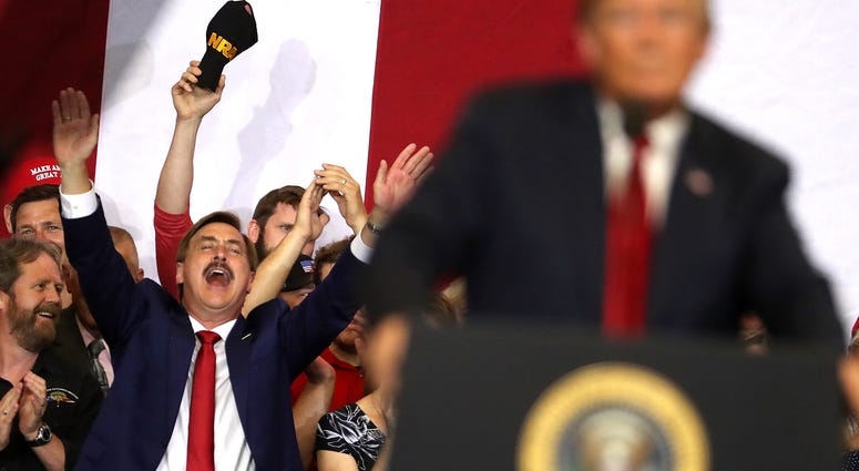 Michael J. Lindell (L) CEO of My Pillow, cheers as U.S. president Donald Trump speaks to supporters during a campaign rally at Scheels Arena on June 27, 2018 in Fargo, North Dakota. Michael J. Lindell (L) CEO of My Pillow, cheers as U.S. president Donald Trump speaks to supporters during a campaign rally at Scheels Arena on June 27, 2018 in Fargo, North Dakota.