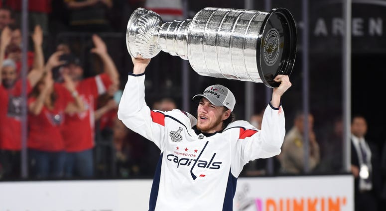 The Stanley Cup raised by TJ Oshie TJ Oshie raises the Stanley Cup