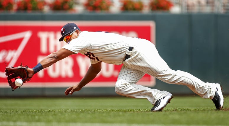 Grounder at Escobar Escobar dives for grounder