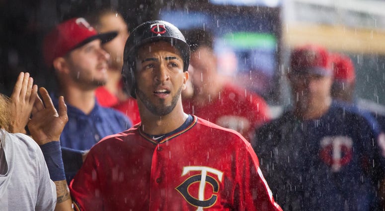 Rain falls on Eddie Rosario and the Twins Eddie Rosario looks at the rain
