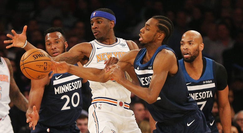 A loose ball is corralled by Andrew Wiggins Andrew Wiggins goes for a loose ball