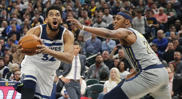 Karl-Anthony Towns under the basket Karl-Anthony Towns has the ball