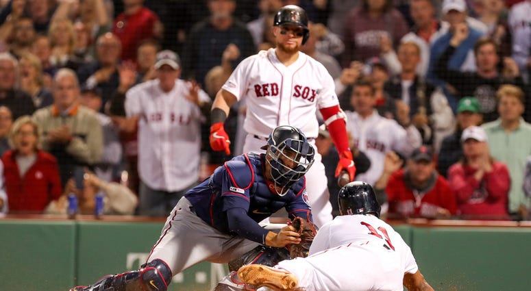 Out at the plate to end the game Twins catcher Jason Castro makes the tag