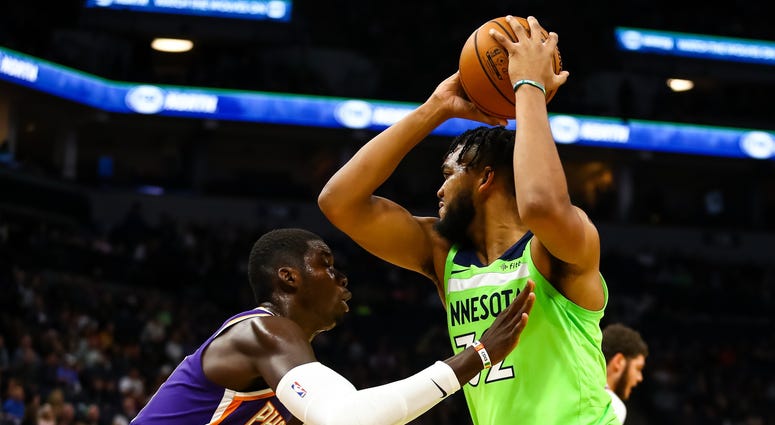 Cheick Diallo guards Karl-Anthony Towns Karl-Anthony Towns with the ball against Cheick Diallo