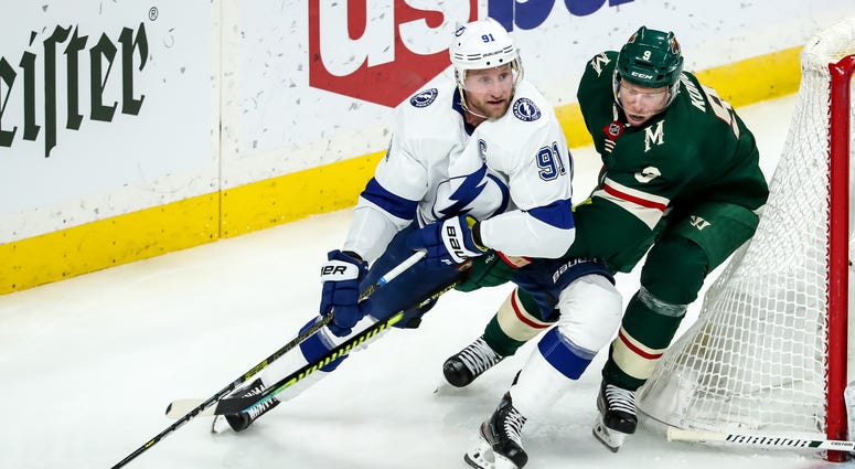 Mikko Koivu tries to stop Steven Stamkos Steven Stamkos goes up against Mikko Koivu