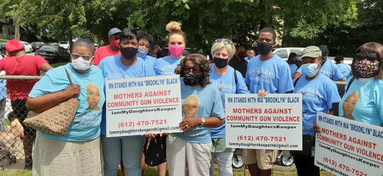St. Paul mayor Melvin Carter stands with the family of Nia Black ahead of Saturday's march.